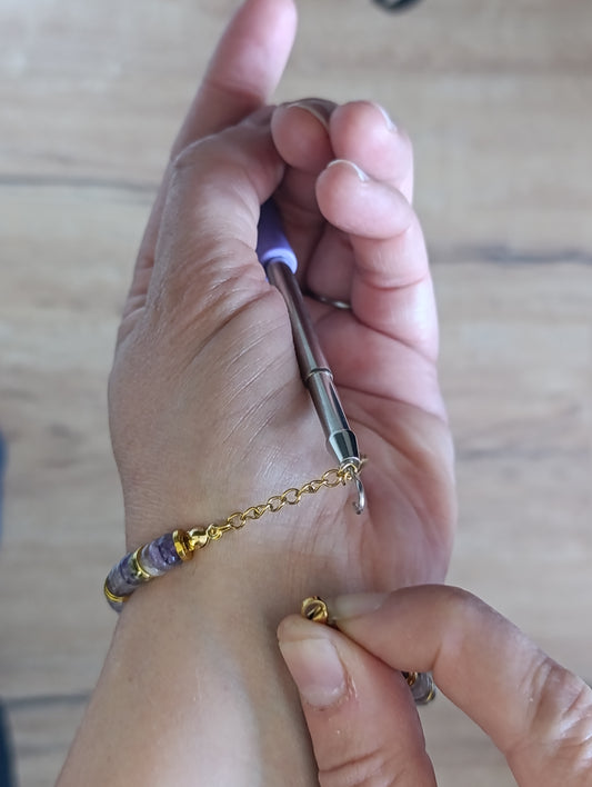 Aide accroche bracelet
